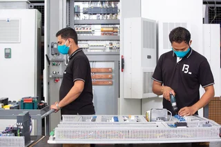 Two employees in the in-house switchgear construction in India