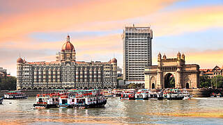 Mumbai's harbour with the Gateway of India triumphal arch and the Taj Mahal Palace Hotel